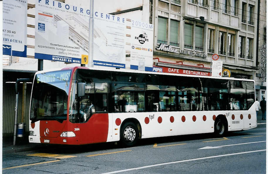 (052'114) - TPF Fribourg - Nr. 384/FR 300'387 - Mercedes am 17. Februar 2002 beim Bahnhof Fribourg