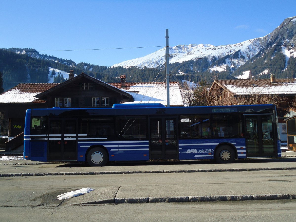 (137'141) - AFA Adelboden - Nr. 54/BE 611'056 - Neoplan (ex VBZ Zrich Nr. 243) am 11. Dezember 2011 beim Bahnhof Lenk