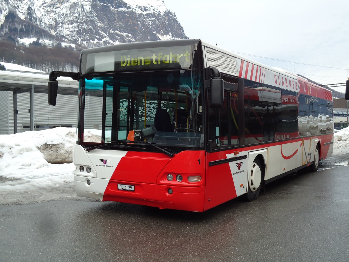 (142'576) - AS Engi - Nr. 11/GL 1029 - Neoplan (ex Nr. 1; ex SBC Chur Nr. 107) am 23. Dezember 2012 beim Bahnhof Schwanden 