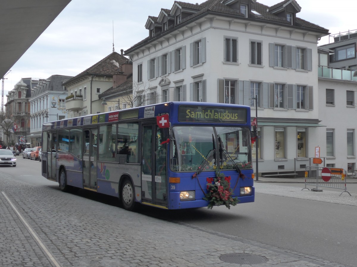 (157'766) - VZO Grningen - Nr. 39/ZH 242'853 - Mercedes (ex Schneider, Meilen Nr. 7) am 14. Dezember 2014 beim Bahnhof Uster