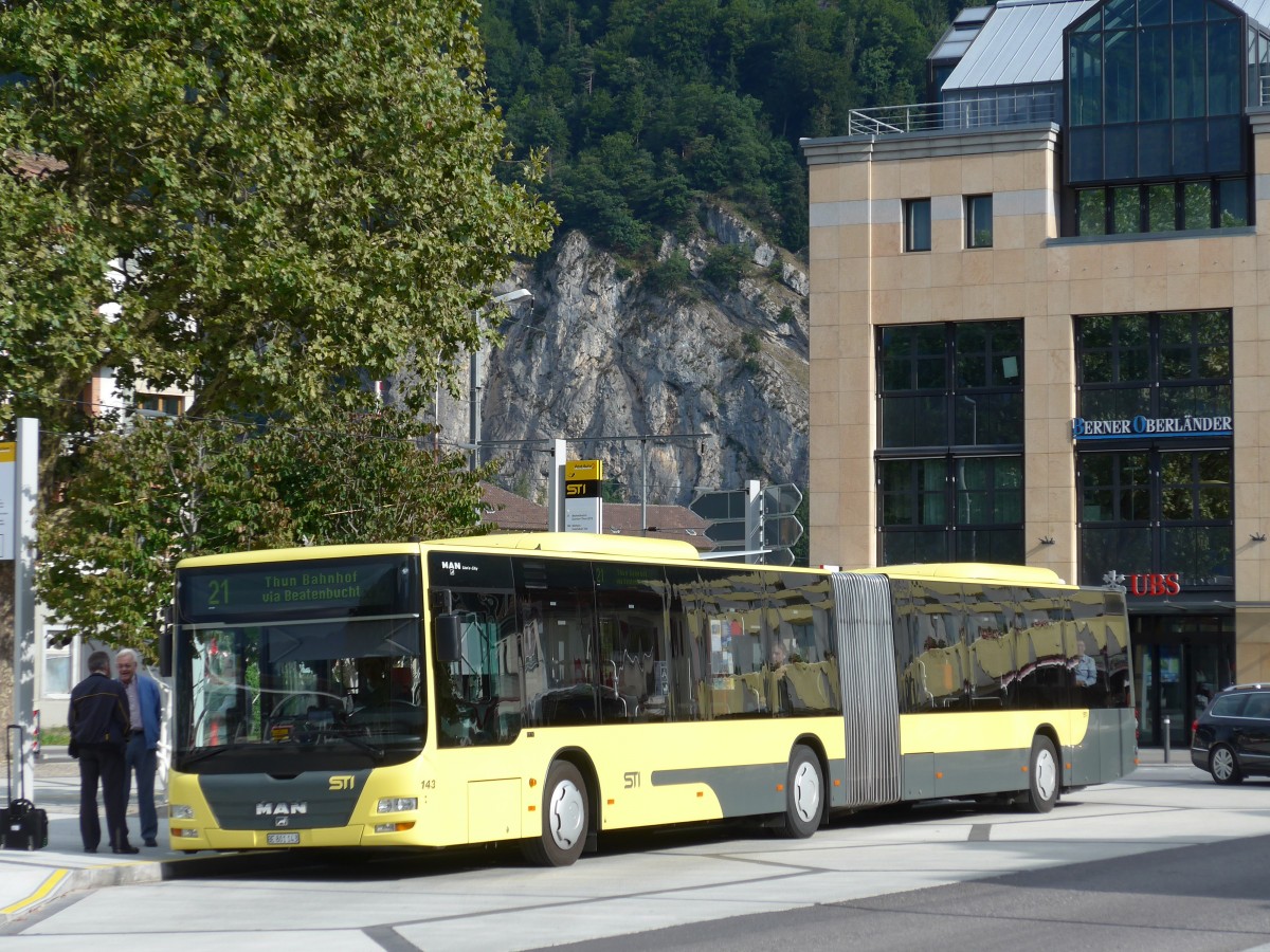 (163'741) - STI Thun - Nr. 143/BE 801'143 - MAN am 23. August 2015 beim Bahnhof Interlaken West
