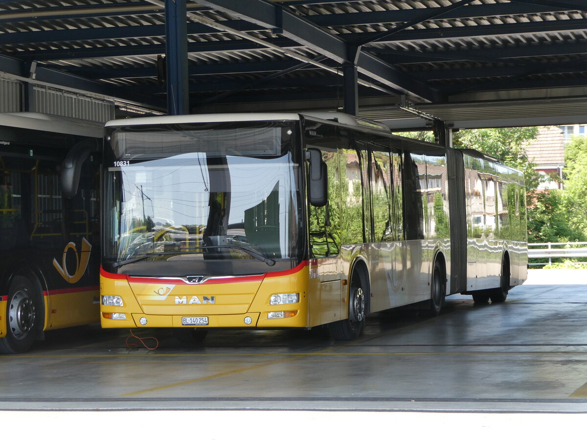 (252'413) - PostAuto Nordschweiz - BL 140'254/PID 10'831 - MAN am 7. Juli 2023 in Laufen, Garage