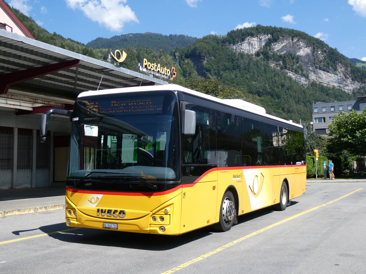 (265'616) - Flck, Brienz - Nr. 26/BE 868'726/PID 11'668 - Iveco am 13. August 2024 in Meiringen, Postautostation