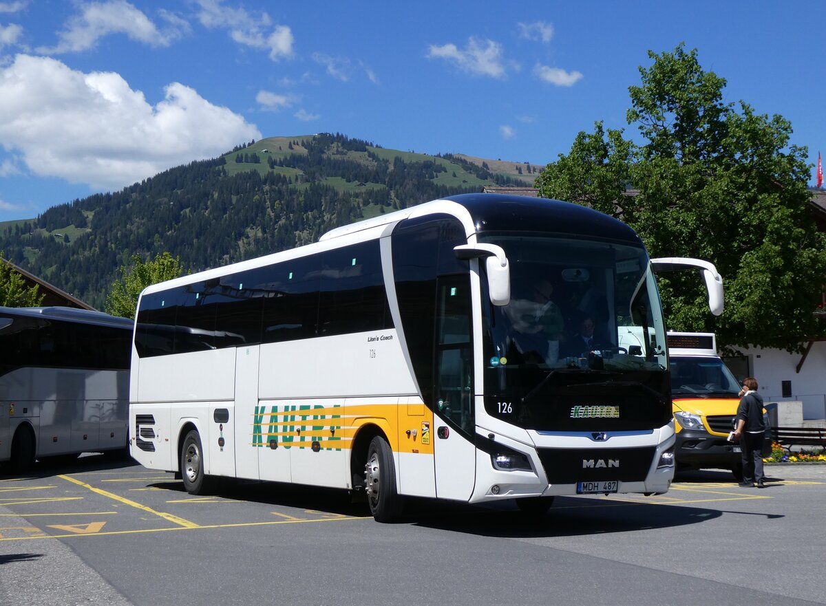 (275'615) - Aus Litauen: Jouzapaviciaus, Kaunas - Nr. 126/MDH 487 - MAN am 16. Mai 2025 beim Bahnhof Gstaad