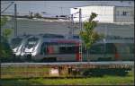 Ein erster Blick auf die neuen Talent 2 f�r die ABELLIO Rail NRW GmbH. Hier 9442 101-3 inmitten weiterer Z�ge am 13.08.2014 auf dem Bombardier-Werksgel�nde in Hennigsdorf b. Berlin (NVR-Nummer 94 80 9442 101-3 D-ABRN, fotografiert durch Zaun)