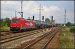 RheinCargo 2066 / 185 631-9 mit einem Kesselwagen-Zug am 07.09.2014 durch Berlin Sch�nefeld Flughafen