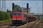 DB Schenker 155 132-4 mit einem Schotterzug am 23.07.2012 in Berlin Schnefeld Flughafen