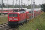 Die Rostocker 112 104-5 mit RE 5 nach Rostock Hbf bei der Einfahrt im Rostocker Hbf.10.09.2011 