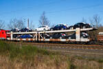 Doppelstock-Autotransportwagen 23 80 4351 950-9 D-ATG, der Gattung Laaes 556, der DB Cargo Logistics GmbH (ex DB Schenker ATG) am 07.02.2023 im Zugverband bei einer Zugdurchfahrt in