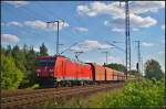 DB Schenker 185 210-2 mit Sch�ttgut am 28.08.2014 durch die Berliner Wuhlheide