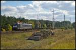 Lotos ES 64 F4-452 / 5170 026 mit einem m��ig ausgelastetem Container-Zug am 01.10.2013 durch die Berliner Wuhlheide