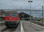 Die SBB Re 4/4 II 11115 mit ein %6 achsigen Pilgerzug (SBB Salonwagen, SNCB (!) B, und 12 SBB Bpm 51) auf dem Weg nach Lourdes sowie SBB Re 460 050-7  RailAway .