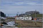 Einer der letzten Züge auf dem am Folgetag stillgelegten Abschnitt zwischen dem  alten  Bahnhof von Châtel St-Denis und Abzweigung zum im Hintergrund zu sehenden Durchgangsbahnhof von